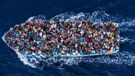 June 7, 2014 - Mediterranean Sea / Italy: Italian navy rescues asylum seekers traveling by boat off the coast of Africa. More than 2,000 migrants jammed in 25 boats arrived in Italy June 12, ending an international operation to rescue asylum seekers traveling from Libya. They were taken to three Italian ports and likely to be transferred to refugee centers inland. Hundreds of women and dozens of babies, were rescued by the frigate FREMM Bergamini as part of the Italian navy's "Mare Nostrum" operation, launched last year after two boats sank and more than 400 drowned. Favorable weather is encouraging thousands of migrants from Syria, Eritrea and other sub-Saharan countries to arrive on the Italian coast in the coming days. Cost of passage is in the 2,500 Euros range for Africans and 3,500 for Middle Easterners, per person. Over 50,000 migrants have landed Italy in 2014. Many thousands are in Libya waiting to make the crossing. (Massimo Sestini/Polaris)